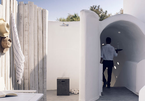 Knossos Beach Room Service waiter on his way to a room