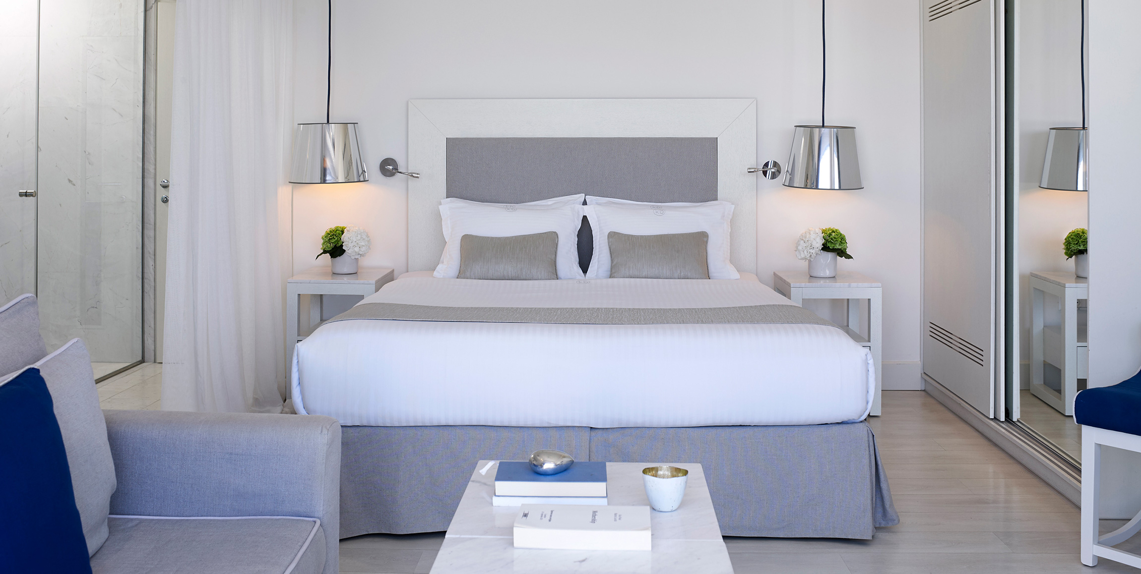 Knossos Beach Two Bedroom Suite Sea View double bed and amenities