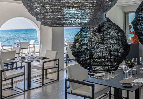 Knossos Beach Si La Restaurant interior sitting area