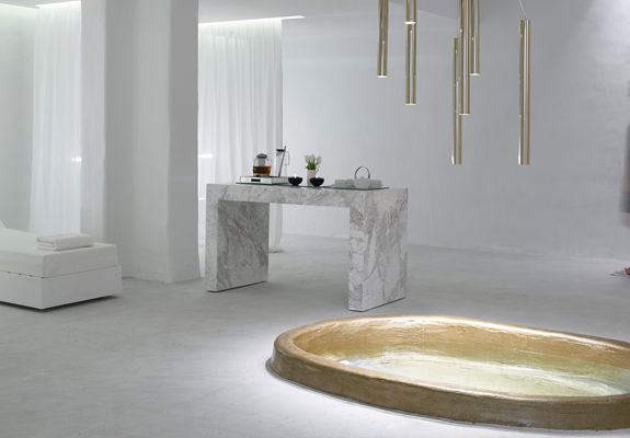 Knossos Beach Wellness Rejuvenate indoor mini pool and bed next to a desk