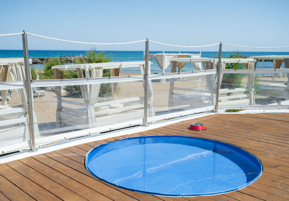 Knossos Beach Dog Pool and a food bowl on the side
