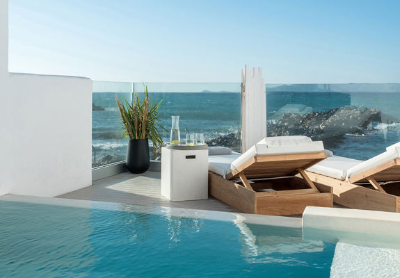 Knossos Beach Two Bedroom Suite Water Front Private Pool the pool with sunbeds and amenities