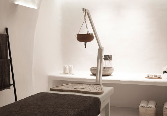Knossos Beach Wellness Rejuvenate spa room with bed and amenities